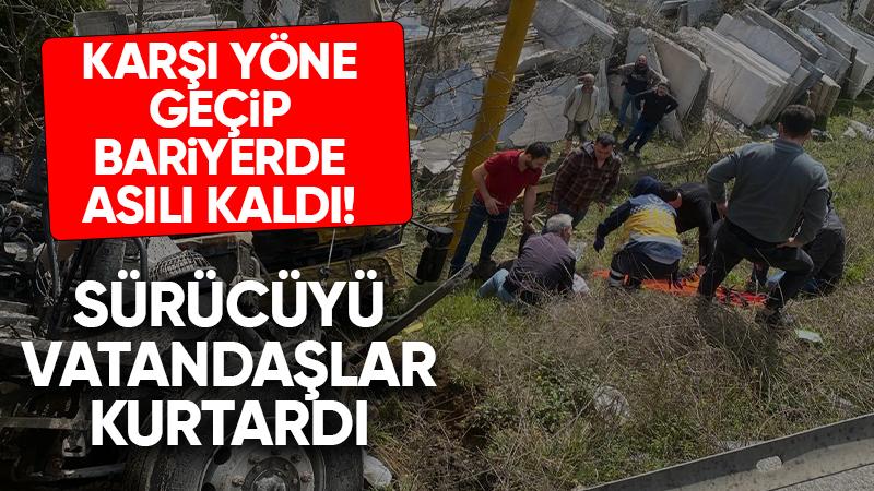 Karşı yöne geçip bariyerlerde asılı kaldı!